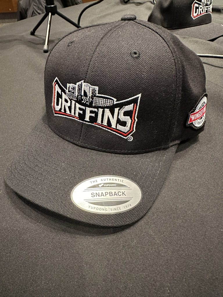 2024 Griffins cap on event table — front